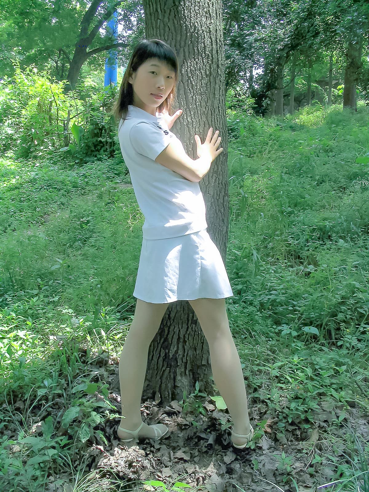 Close-up of wet nylon stretching across toes, sheen of water catching sunlight and emphasizing the foot’s delicate contours